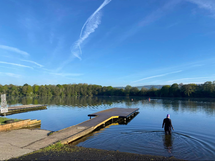Swimmers at sunrise on a Kent lake